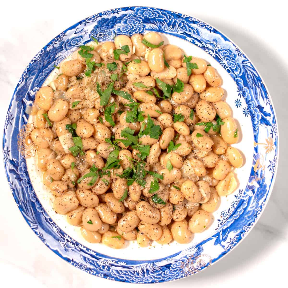 A serving of Cacio e Pepe Beans on a plate.
