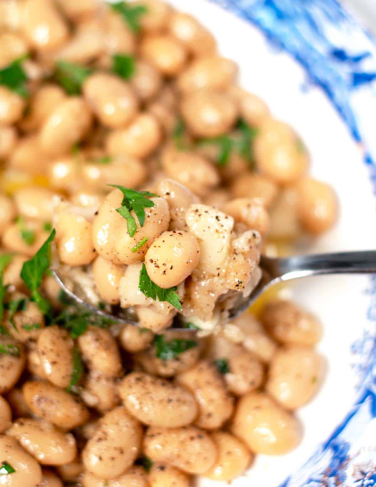 Closeup on a large spoon of Cacio e Pepe Beans.
