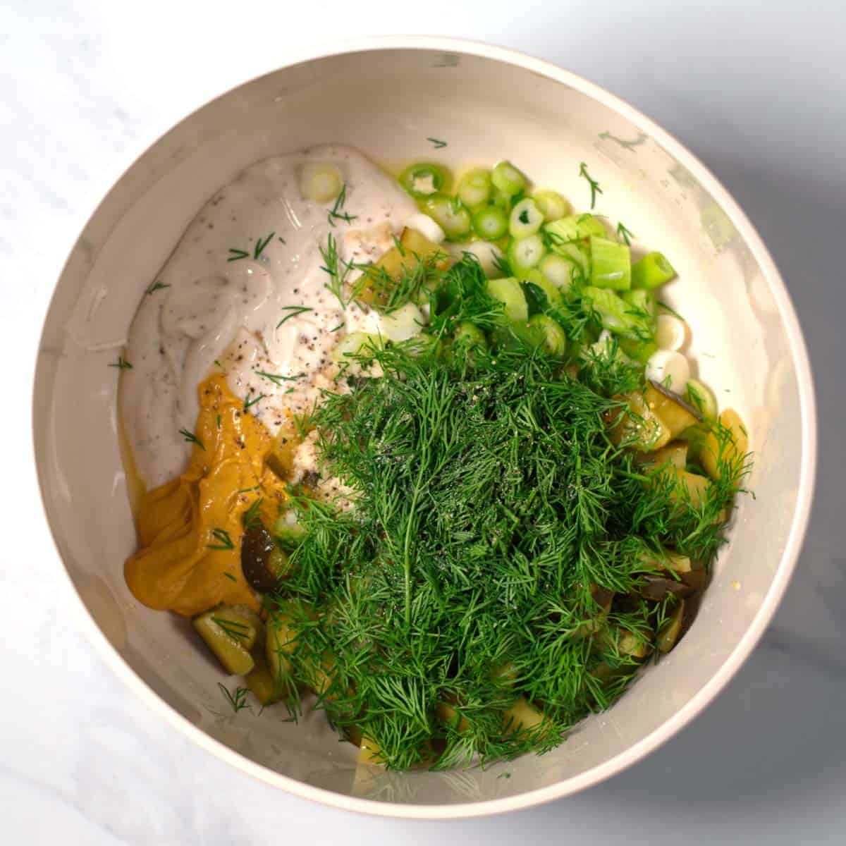 Ingredients for the dressing are given into a bowl.