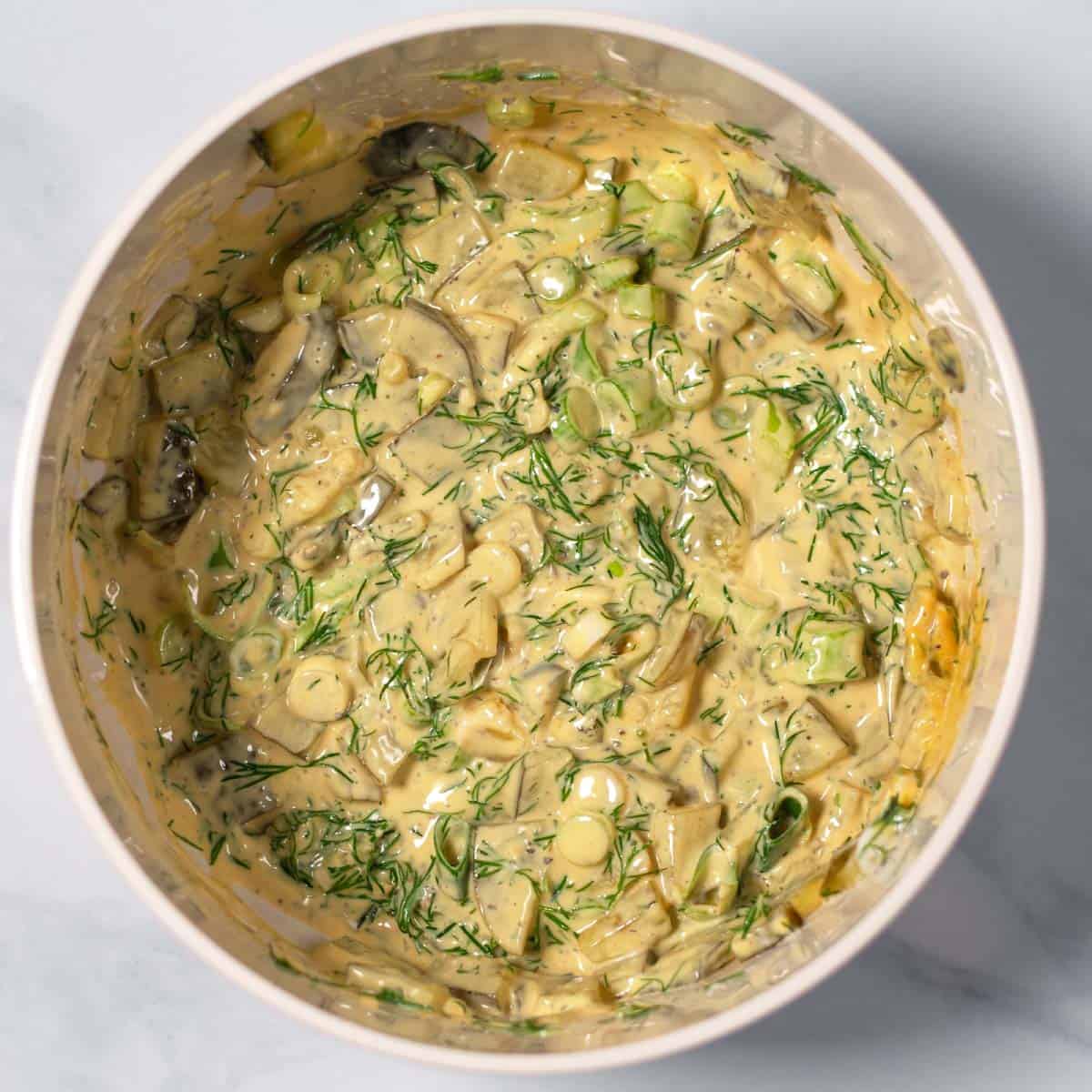 Ready dressing for the Cauliflower Potato Salad in a mixing bowl.