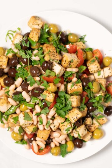 Top view of a serving of Olive Salad on a white plate.
