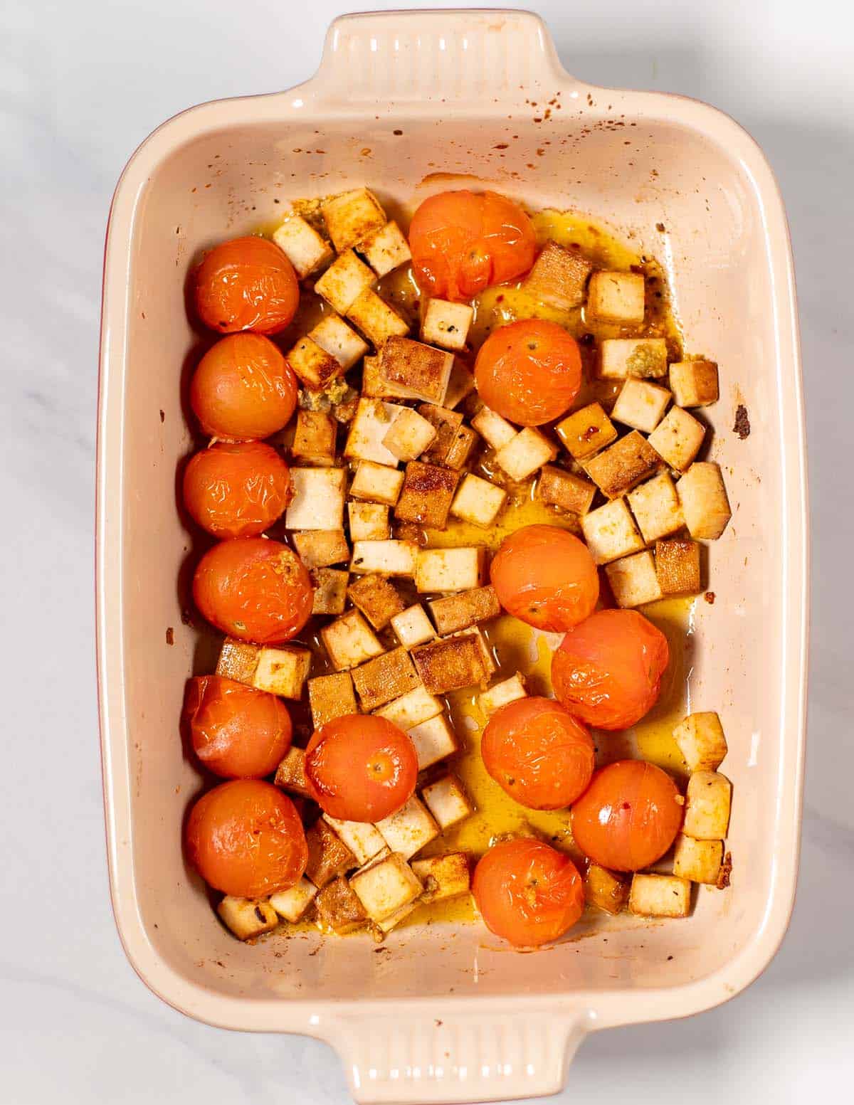 Oven roasted smoked tofu in a baking dish.