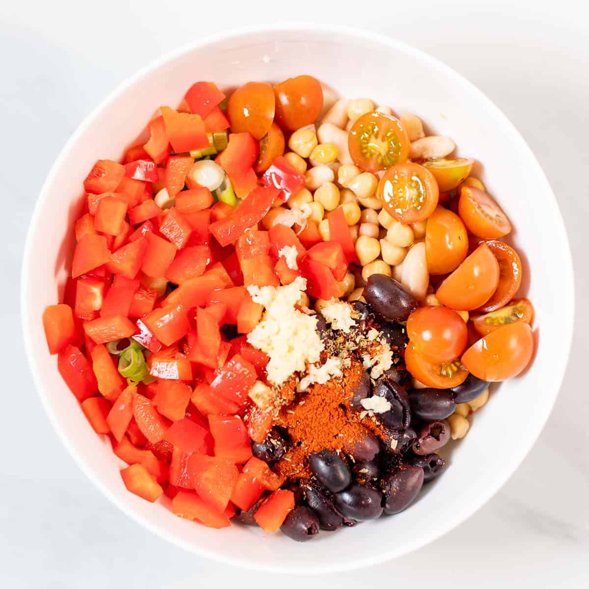 Ingredients for Dense Bean Salad are given into a large mixing bowl.