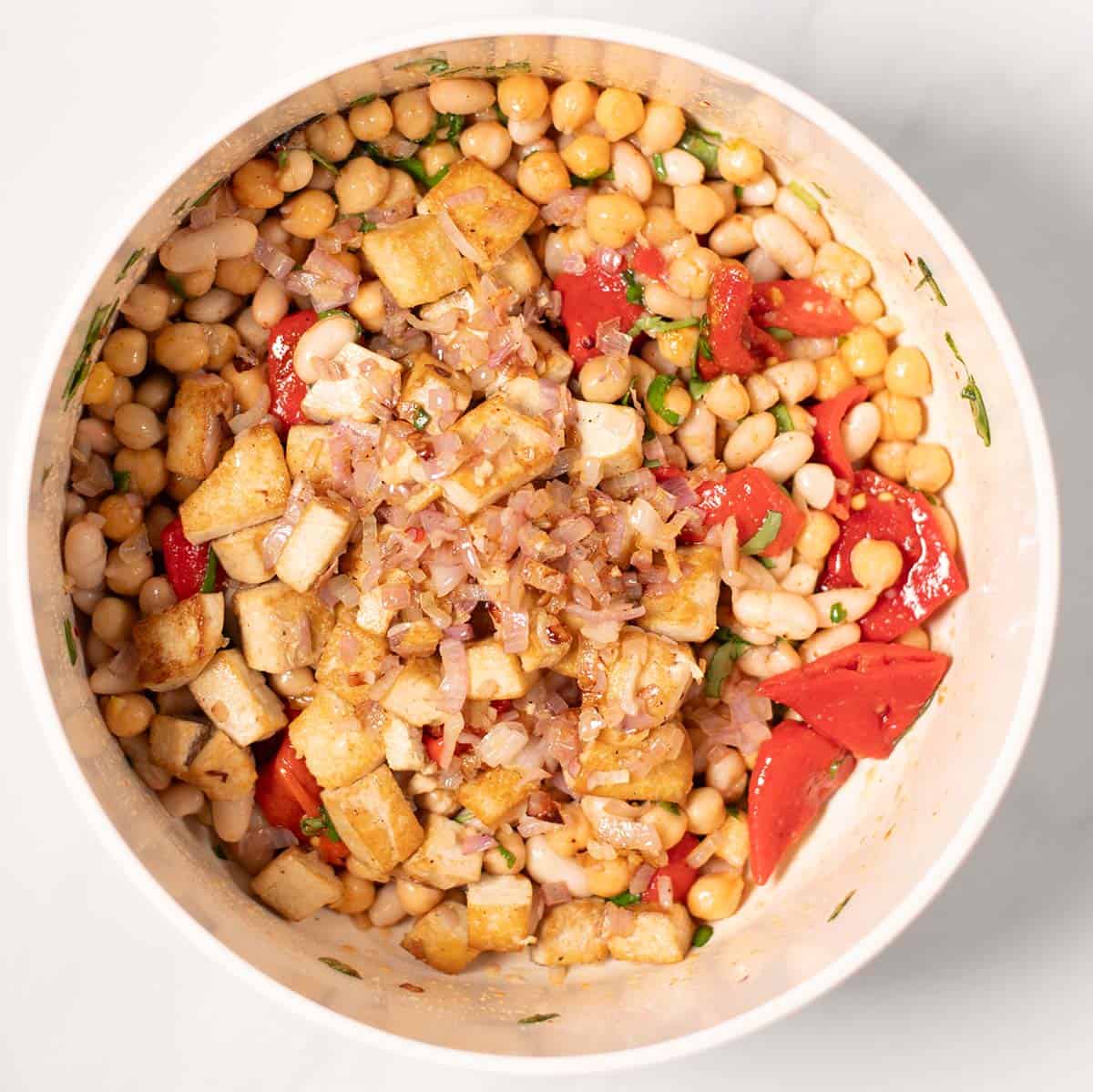 The pan-fried smoked tofu and shallots are given over the remaining Grinder Salad ingredients.