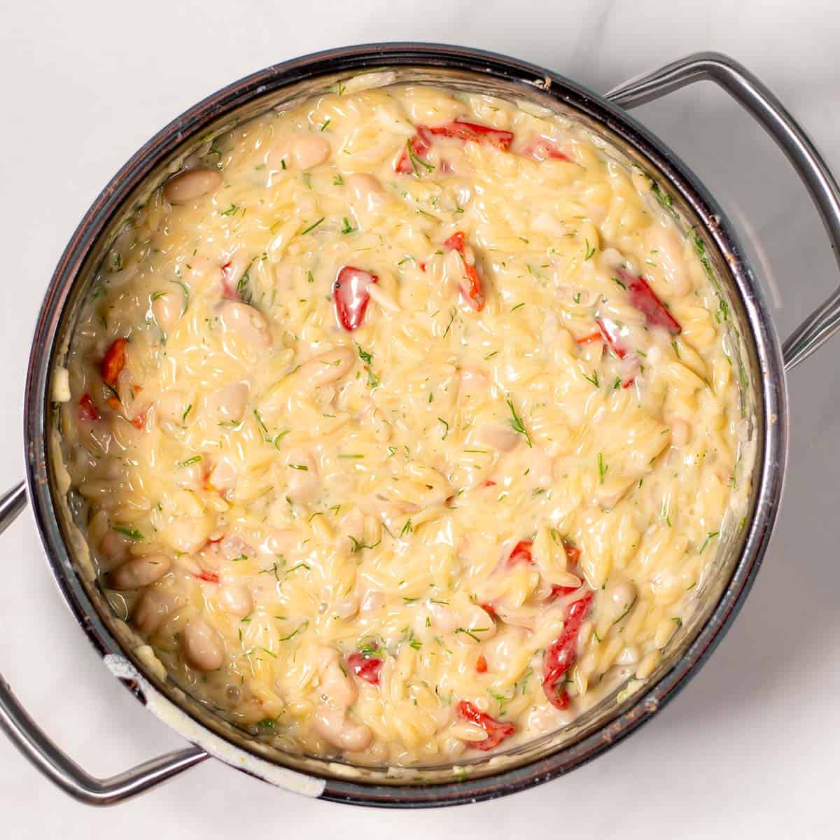 Ready Creamy Lemon Orzotto in a pot.