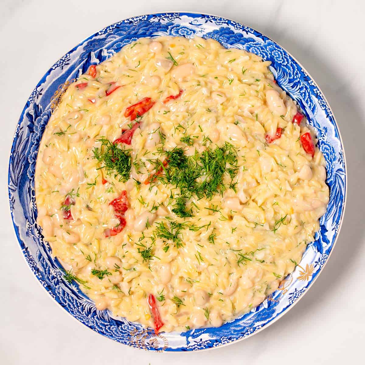 A large serving bowl with Creamy Lemon Orzotto.