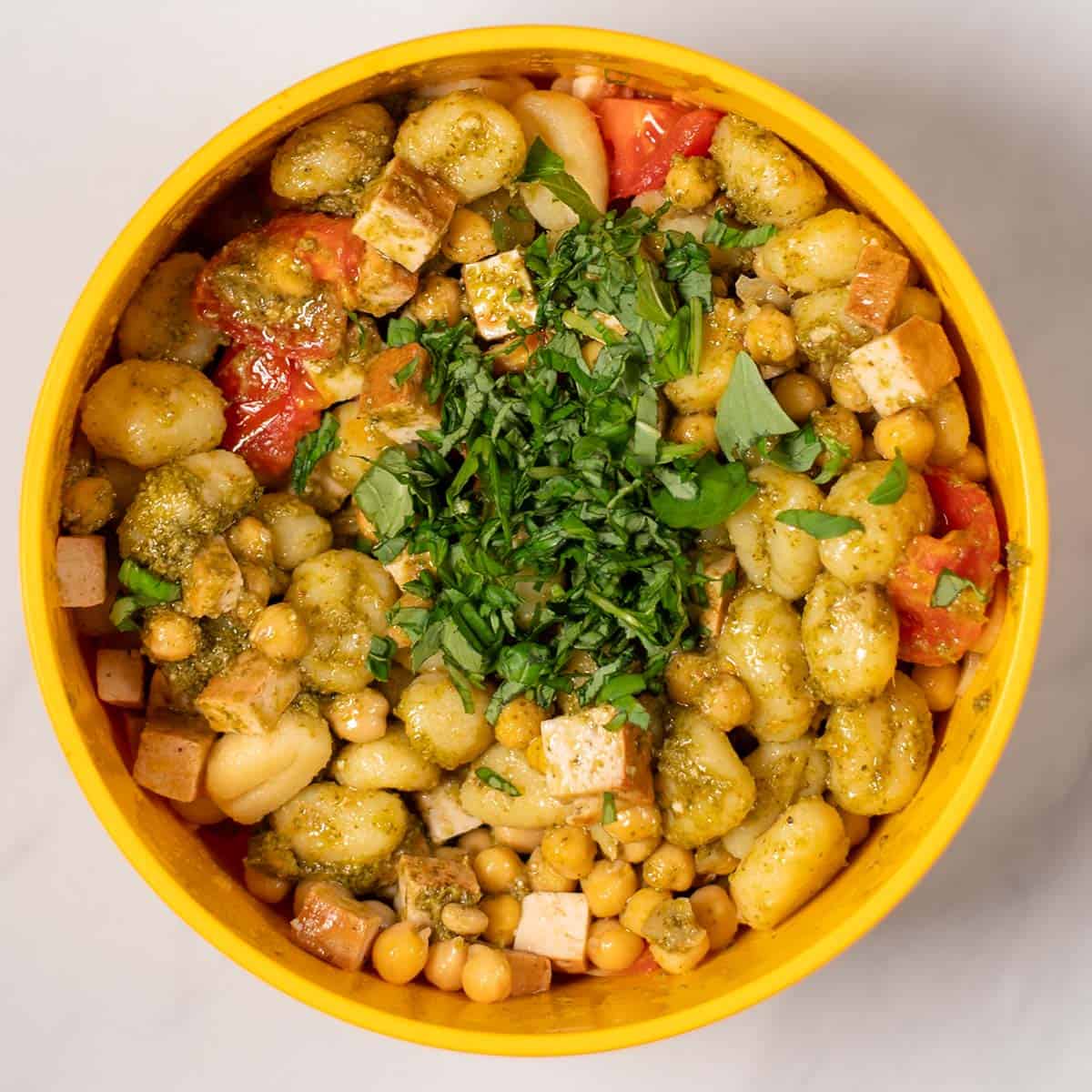 Fresh basil is given over the Pesto Gnocchi.