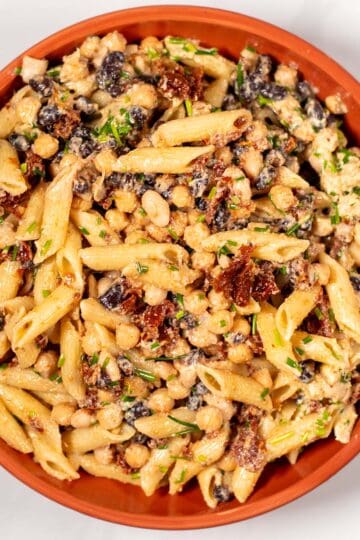 Three Bean Pasta Salad is served in a plate.