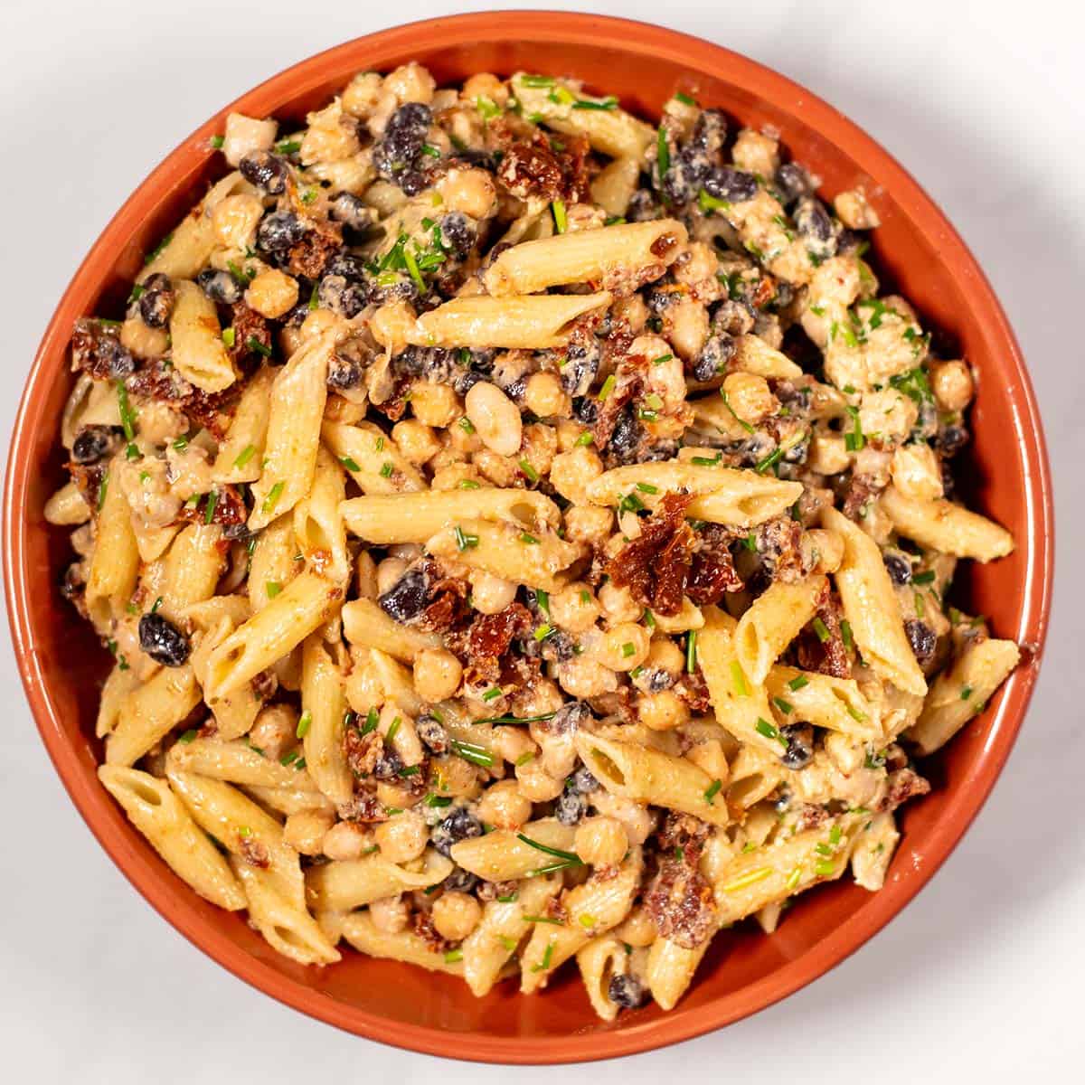 Three Bean Pasta Salad is served in a plate.