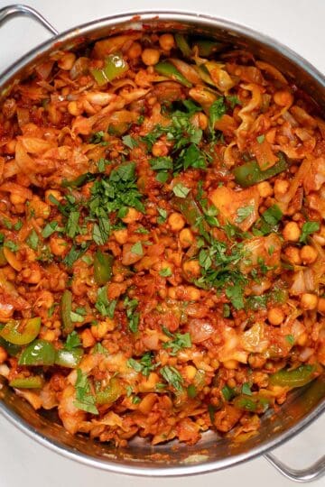 Fresh herbs are used as garnish for Dirty Cabbage.