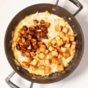 Crispy tofu and soy mushrooms top the creamy corn sauce.