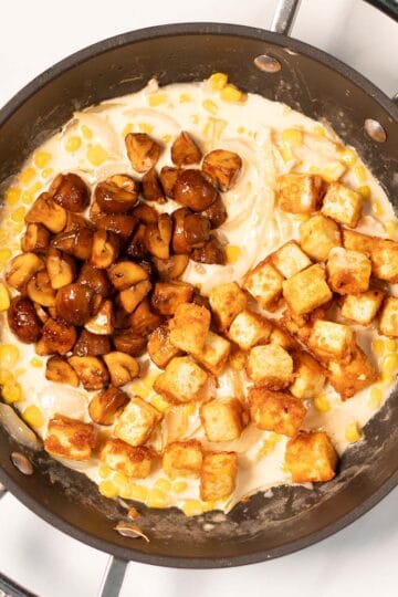 Crispy tofu and soy mushrooms top the creamy corn sauce.