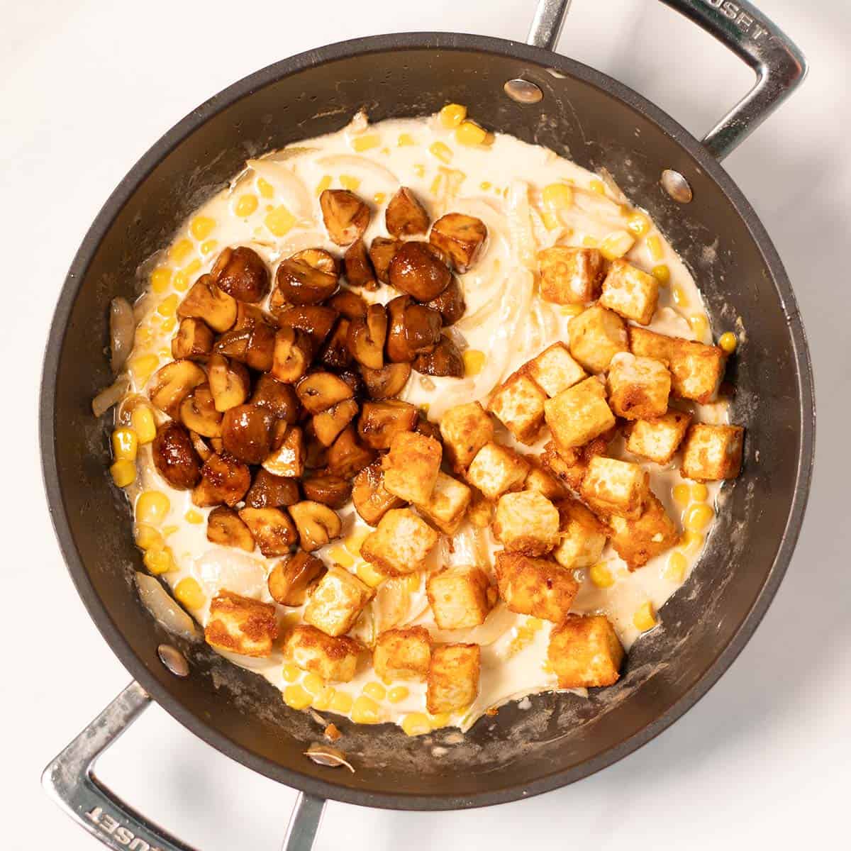 Crispy tofu and soy mushrooms top the creamy corn sauce.