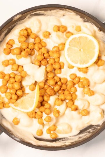 Toasted chickpeas top the Lemon Gnocchi, lemons are used as garnish.