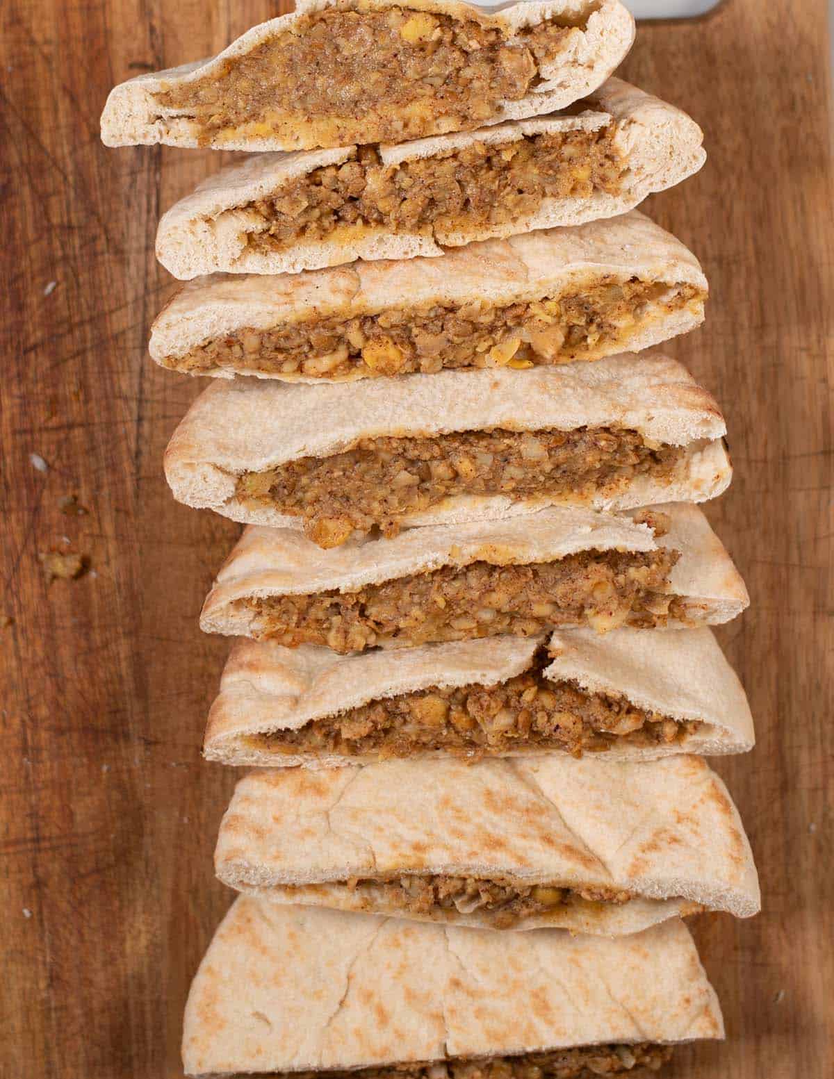 Row of filled vegan Arayes before frying.