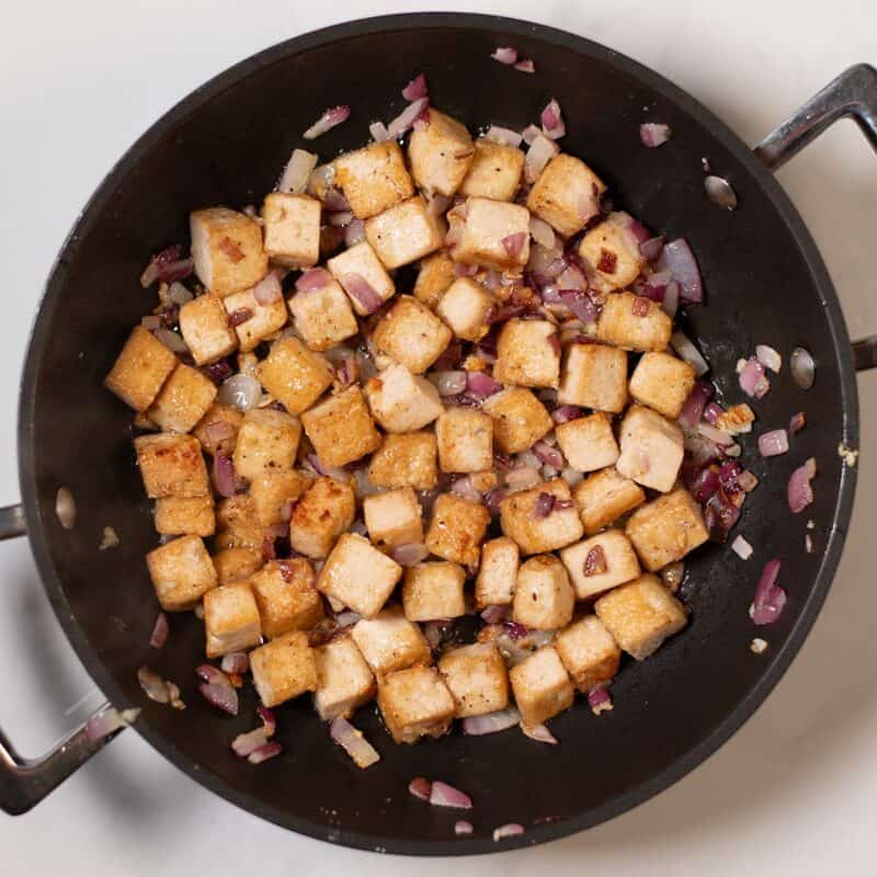 Finley diced red onions and golden tofu.