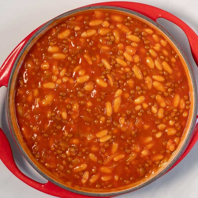 Tomato Sauce is added to the pan with the beans and lentil mixture.