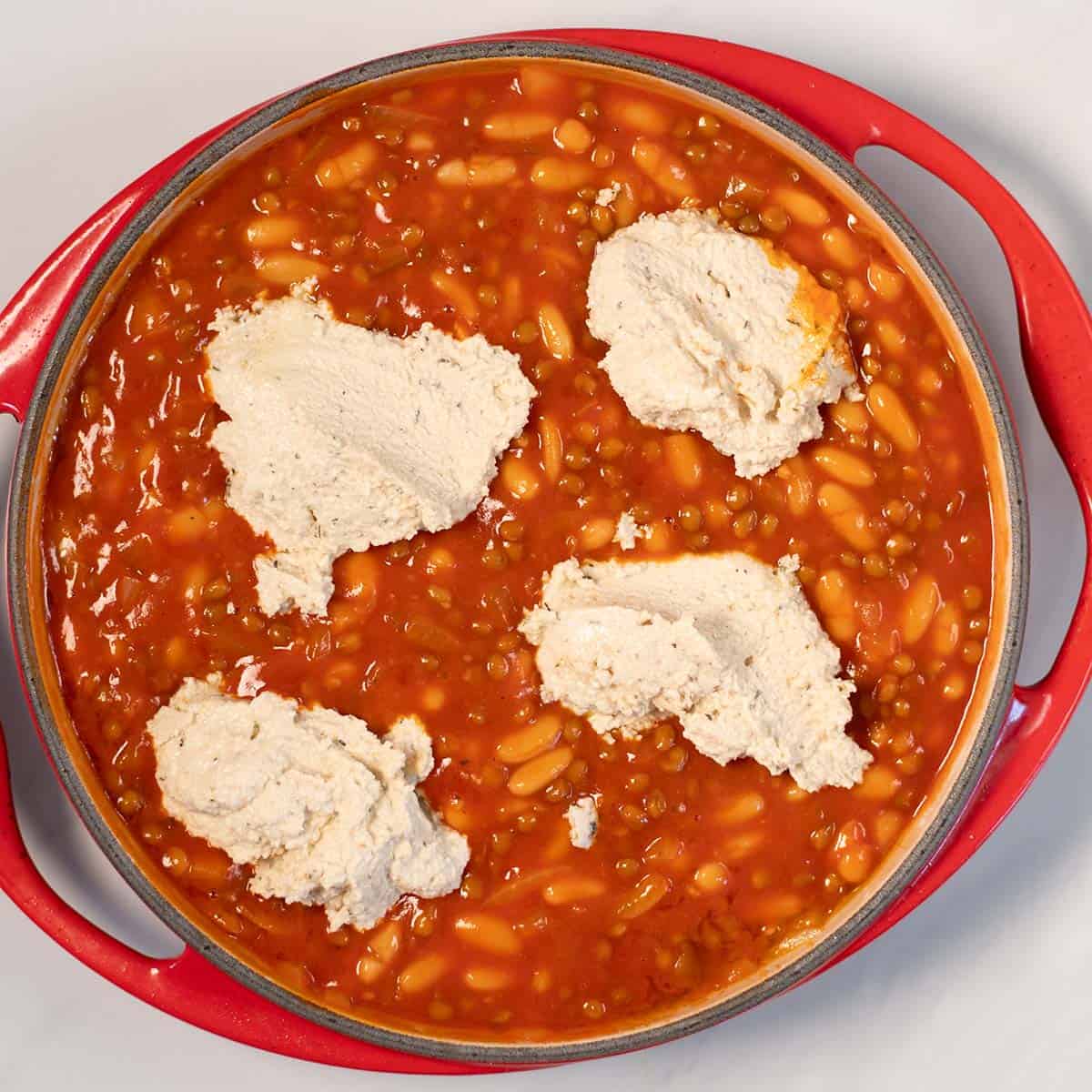 Big dollops of tofu ricotta are topping the lasagna beans.