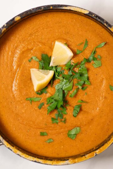Parsley and lemon are used as garnish.