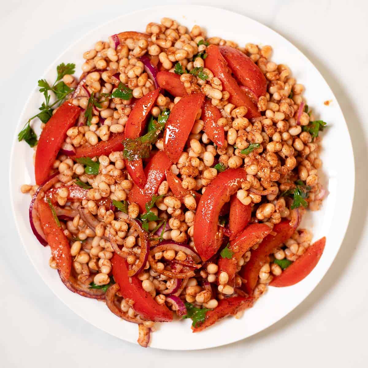 Large serving of Piyaz on a plate.