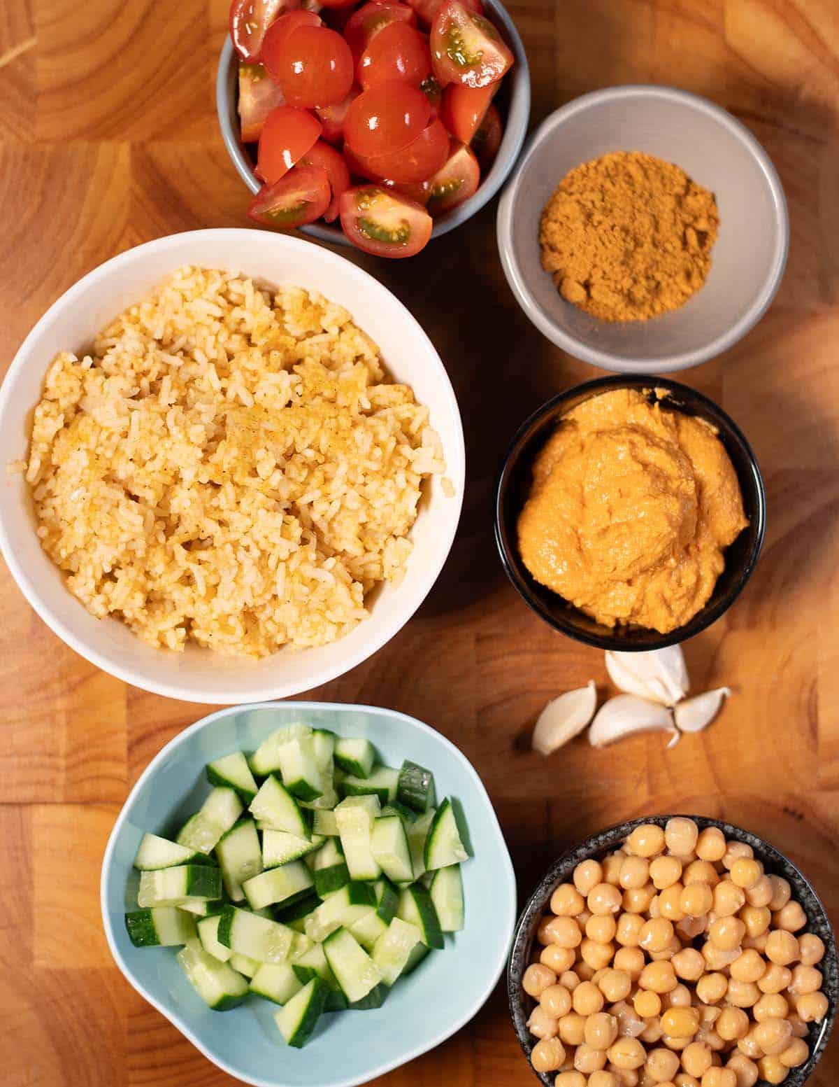 Fresh vegetables, chickpeas, and spices for chickpea shawarma bowls.