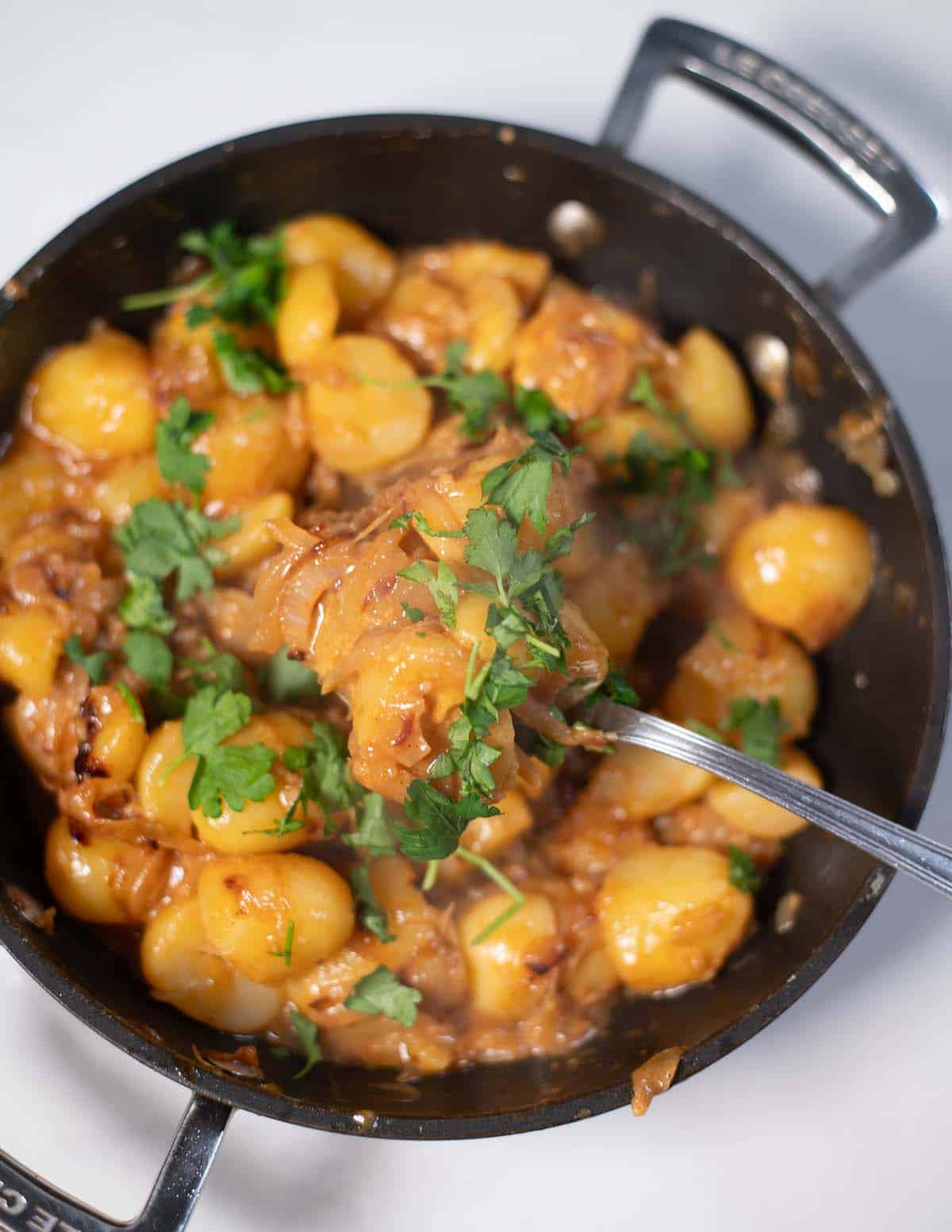 Creamy French onion potatoes skillet with herbs.