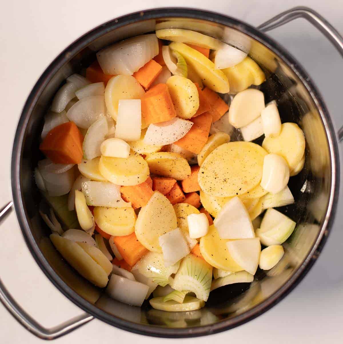 Chopped onions, carrots, and garlic for Greek chickpea soup.