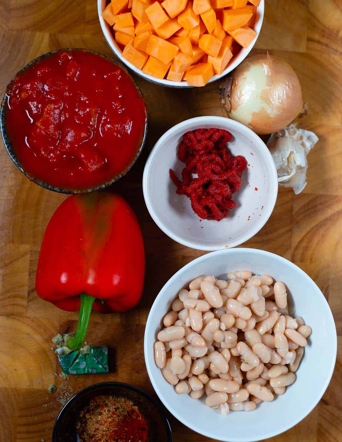 Ingredients for sweet potato chili with white beans and vegetables.